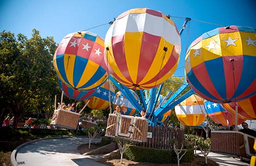 Families riding on a hot air balloon ride at Gilroy Gardens