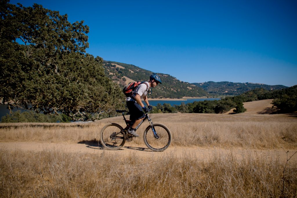 Man riding his bike on a trail at Harvey Bear Park