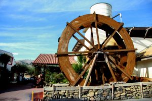 Sluice wooden water wheel at Casa de Fruta