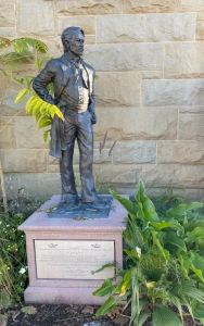 John Gilroy statue with pedastal