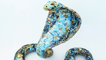 Dark blue, light blue and gold snake sculpture