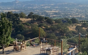 a deck with seating overlooking the Santa Clara Valley