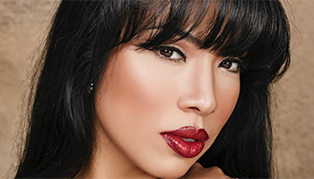 Close up image of a woman with red lipstick and black hair