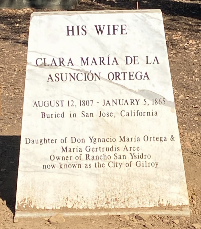 a marble monument with black lettering for Clara Maria Ortega