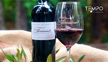 A bottle of Fernwood Cellars Cabernet Sauvignon next to a wine glass