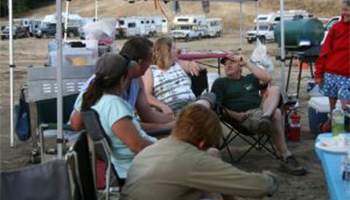 People camping and talking