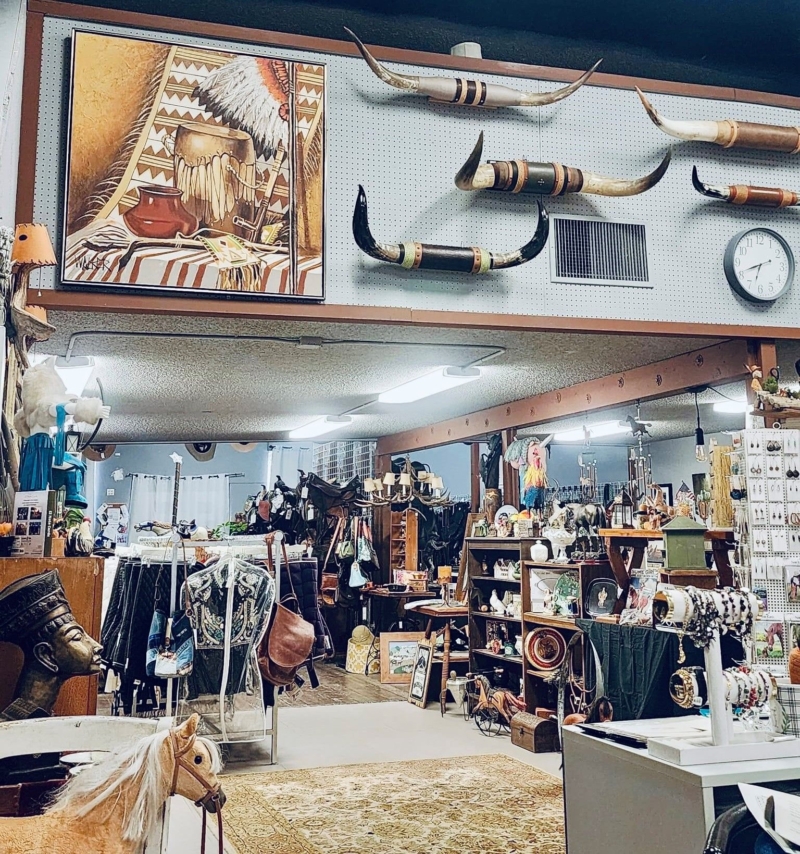 a store with western items including steer horns up on the wall