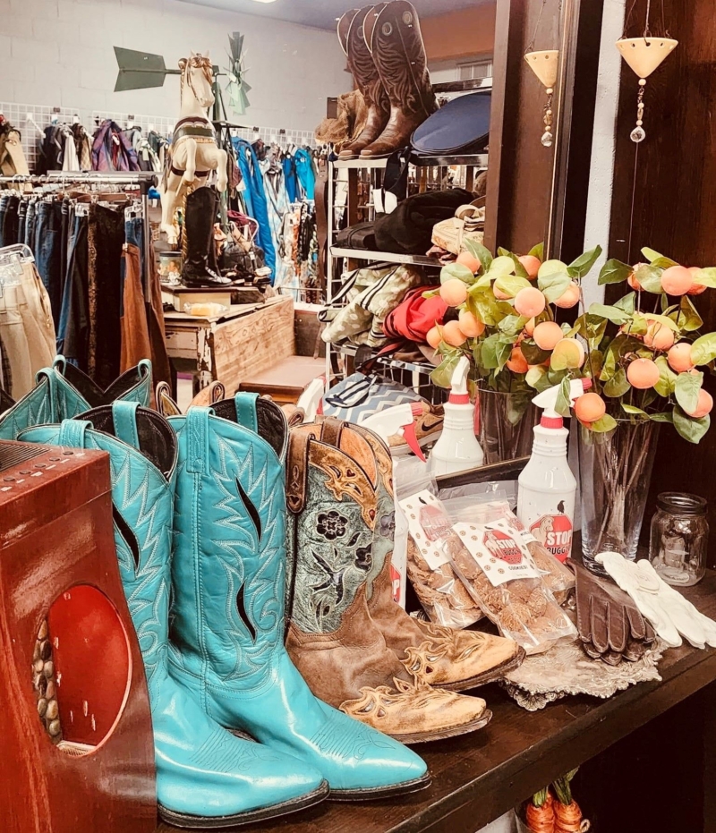 turquoise boots and other western wear and items in a store