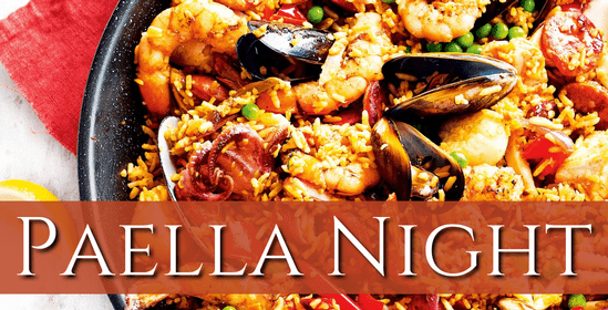 A vibrant plate of Paella featuring rice with shellfish and other seafood